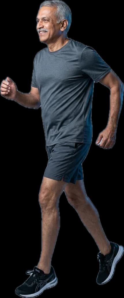 A man in his sixties walking briskly