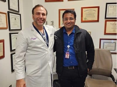 Dr. Yash Shah with a mentor in a hospital office
